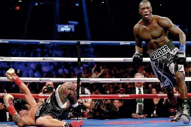 SE ACABO. Deontay Wilder manda a la lona a Szpilka (AFP).